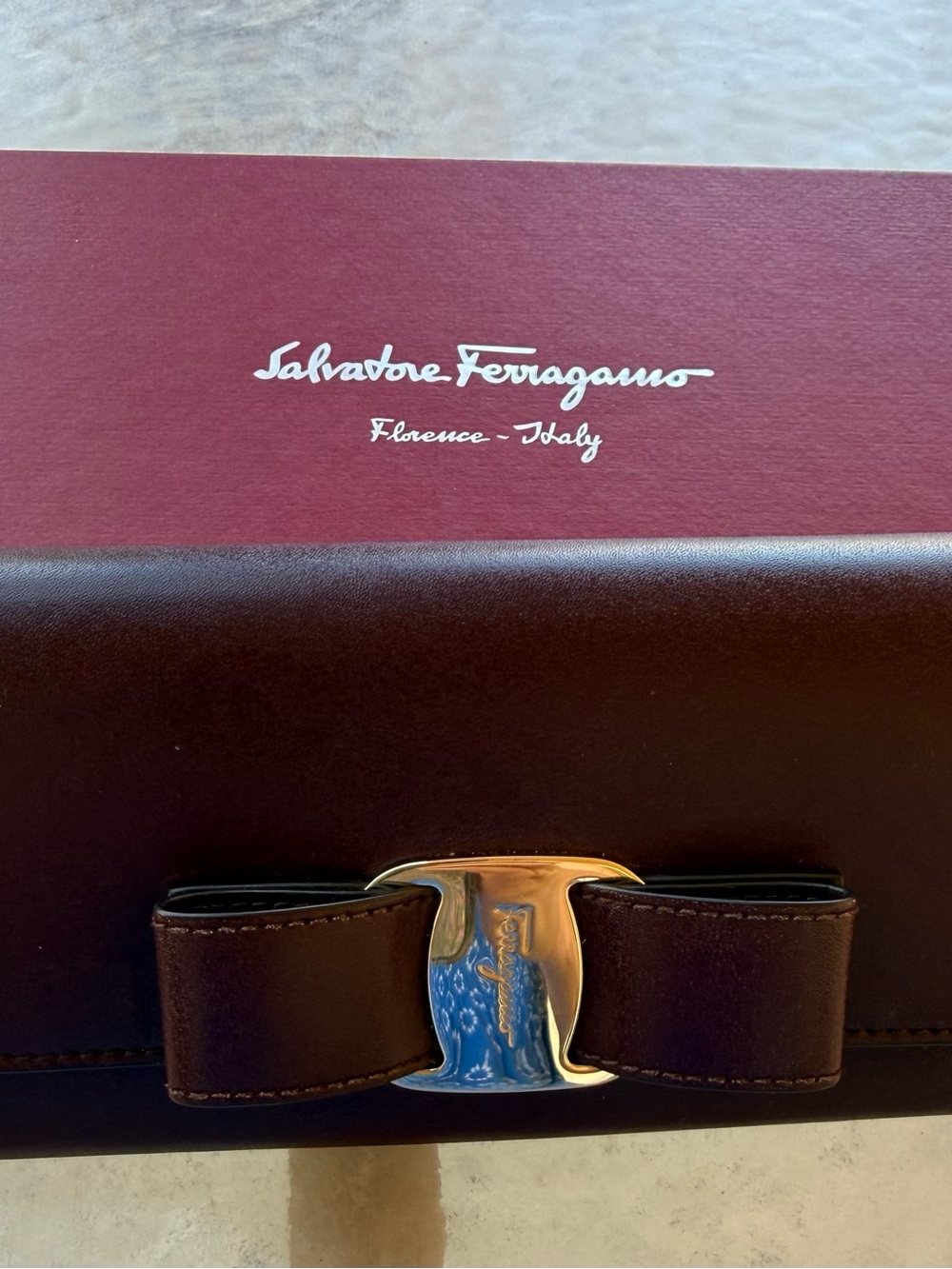 Salvatore Ferragamo Dark Burgundy Leather Wallet with Gold Bow Accent